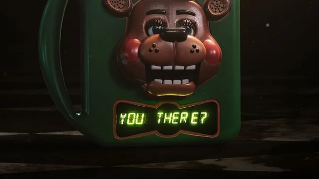 پوستر رسمی فیلم Five Nights at Freddy’s 2 که اسباب‌بازی FazTalker را با پیام 'تو آنجایی؟' نشان می‌دهد